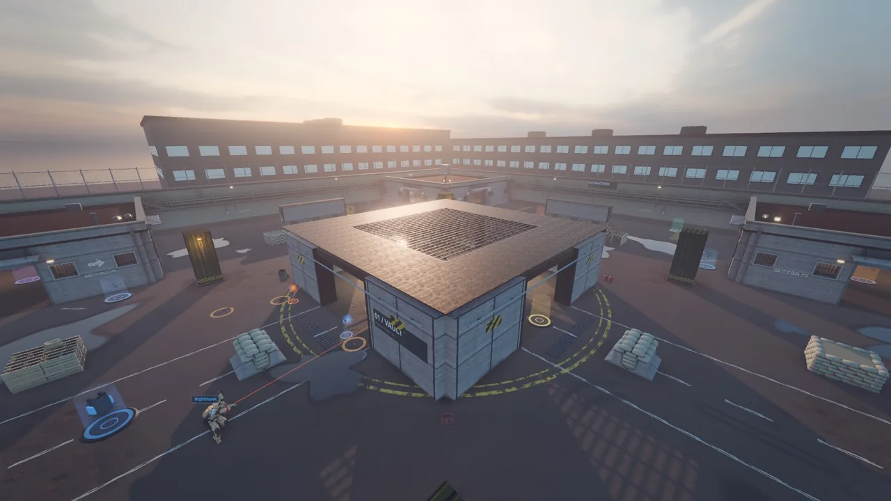 Blacksite from above at dusk: the walled compound with its square central vault, corner rooms, sandbag cover and a low sun over the buildings.